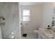 Bright bathroom with white marble-look flooring, shower and sink at 881 Saluda Rd, Chester, SC 29706