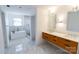 Bathroom with double sink vanity, marble floors, shower, and tub at 881 Saluda Rd, Chester, SC 29706