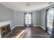 Bedroom with gray walls, wood-look floors, and fireplace at 881 Saluda Rd, Chester, SC 29706