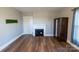 Bedroom with hardwood floors, fireplace, and ample natural light, creating a comfortable atmosphere at 881 Saluda Rd, Chester, SC 29706