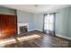Bedroom with gray walls, wood-look floors, fireplace, and built-in cabinet at 881 Saluda Rd, Chester, SC 29706