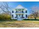 Charming two-story home with a large front yard and a welcoming front porch with blue ceiling at 881 Saluda Rd, Chester, SC 29706