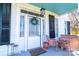 Inviting front porch features wicker seating and a charming wreath on the front door at 881 Saluda Rd, Chester, SC 29706