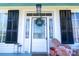 Close-up of the front porch, showing the entrance with a wreath and seating area at 881 Saluda Rd, Chester, SC 29706