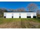 Large four-car garage with metal siding, perfect for car enthusiasts or extra storage space at 881 Saluda Rd, Chester, SC 29706