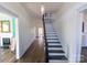 Long, light-filled hallway with hardwood floors and staircase at 881 Saluda Rd, Chester, SC 29706