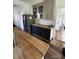 This kitchen features a wood countertop, tile backsplash, and gray cabinets with modern hardware at 881 Saluda Rd, Chester, SC 29706