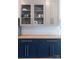 This kitchen offers lots of storage with glass front cabinets above a dark backsplash at 881 Saluda Rd, Chester, SC 29706