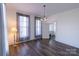 Bright living room featuring hardwood floors, large windows, and modern lighting fixture at 881 Saluda Rd, Chester, SC 29706
