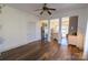 Open concept living area showcases hardwood flooring, a ceiling fan, and access to the kitchen at 881 Saluda Rd, Chester, SC 29706