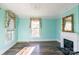 Bright living room with a fireplace, crown molding, and large windows at 881 Saluda Rd, Chester, SC 29706