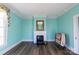 Spacious living room with a fireplace, light blue walls, and natural light at 881 Saluda Rd, Chester, SC 29706