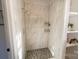 Modern shower with marble-look tile and stylish fixtures at 881 Saluda Rd, Chester, SC 29706