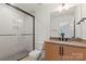 Stylish bathroom featuring modern vanity, glass enclosed shower, and sleek fixtures at 904 Van Every St, Charlotte, NC 28205