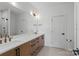 Spacious bathroom with double sinks, quartz counters, ample storage, a large mirror, and modern fixtures at 904 Van Every St, Charlotte, NC 28205