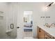 Modern bathroom featuring glass shower and tile walls, plus a view of the bedroom at 904 Van Every St, Charlotte, NC 28205