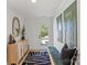 Inviting entryway with modern accents, decorative art, wood-look floors and views of the neighborhood at 904 Van Every St, Charlotte, NC 28205