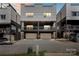 Modern townhome with a two-car garage and balcony area at 904 Van Every St, Charlotte, NC 28205