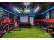 Entertainment room with turf floor, TV, workout gear, and stylish design, perfect for recreation at 904 Van Every St, Charlotte, NC 28205