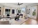 Bright living room with a large sectional, modern decor, and lots of natural light from the large windows at 904 Van Every St, Charlotte, NC 28205