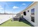 This rooftop deck includes a cozy seating area, television, privacy fence and plenty of space at 904 Van Every St, Charlotte, NC 28205