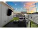 This rooftop deck includes a cozy seating area, television, a privacy fence and plenty of entertaining space at 904 Van Every St, Charlotte, NC 28205