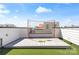 Private rooftop deck with golf practice net and lush turf flooring offering an outdoor recreational space at 904 Van Every St, Charlotte, NC 28205