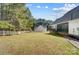 Wide open backyard featuring a white fence, mature trees, and direct access to the home's screened porch at 932 Dovefield Dr, York, SC 29745