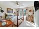 Bright bedroom with a floral comforter, natural light, and vintage decor for a relaxing atmosphere at 932 Dovefield Dr, York, SC 29745