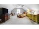 Spacious bedroom with neutral walls, a ceiling fan, TV, and a comfortable bed. Great natural lighting at 932 Dovefield Dr, York, SC 29745
