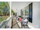 Spacious covered porch with comfortable seating, perfect for enjoying the peaceful surroundings at 932 Dovefield Dr, York, SC 29745