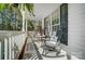 Relaxing covered porch with rocking chairs is the perfect spot to unwind and enjoy the view at 932 Dovefield Dr, York, SC 29745