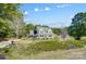 Charming home with inviting front porch, well-maintained landscaping, and mature trees at 932 Dovefield Dr, York, SC 29745