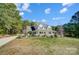 Charming home with inviting front porch, well-maintained landscaping, and a classic white picket fence at 932 Dovefield Dr, York, SC 29745
