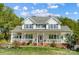 Charming two-story home featuring a spacious porch perfect for relaxing and enjoying the outdoors at 932 Dovefield Dr, York, SC 29745