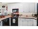Bright kitchen with white cabinets and black appliances at 932 Dovefield Dr, York, SC 29745