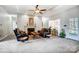 Comfortable living room featuring a ceiling fan and a cozy fireplace at 932 Dovefield Dr, York, SC 29745