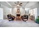 Bright living room with a ceiling fan, fireplace, and comfortable seating at 932 Dovefield Dr, York, SC 29745