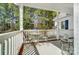 Cozy outdoor seating area on the covered porch offers a peaceful retreat at 932 Dovefield Dr, York, SC 29745