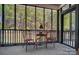 Covered patio with comfortable seating and views of the wooded landscape at 932 Dovefield Dr, York, SC 29745