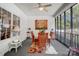 Cozy sunroom featuring wicker chairs, ceiling fan and a view of the wooded landscape at 932 Dovefield Dr, York, SC 29745