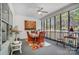 Inviting sunroom with a ceiling fan and large windows providing views of the backyard at 932 Dovefield Dr, York, SC 29745