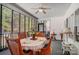 Relaxing sunroom with screened windows and natural light and dining table at 932 Dovefield Dr, York, SC 29745