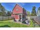 A beautiful backyard with a patio, outdoor seating, and a grill, perfect for outdoor entertaining at 106 Orange St, Charlotte, NC 28205