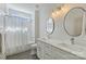 Modern bathroom features double vanity, subway tile shower and updated fixtures at 106 Orange St, Charlotte, NC 28205