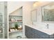 Bathroom with double sinks, storage shelving, and luxurious finishes at 106 Orange St, Charlotte, NC 28205