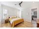 Bright bedroom with hardwood floors, ceiling fan, and ensuite bathroom at 106 Orange St, Charlotte, NC 28205