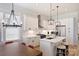 Bright, open kitchen features white cabinets, island, and stainless-steel appliances at 106 Orange St, Charlotte, NC 28205
