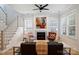 Bright living room featuring a cozy fireplace, staircase, and hardwood floors at 106 Orange St, Charlotte, NC 28205