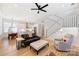 Bright, open-concept living room featuring a modern ceiling fan and staircase at 106 Orange St, Charlotte, NC 28205